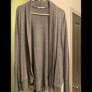 Grey sweater with thumb holes.